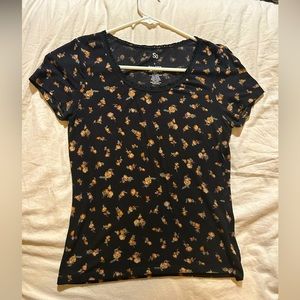 Black top with lace trim and orange floral detail